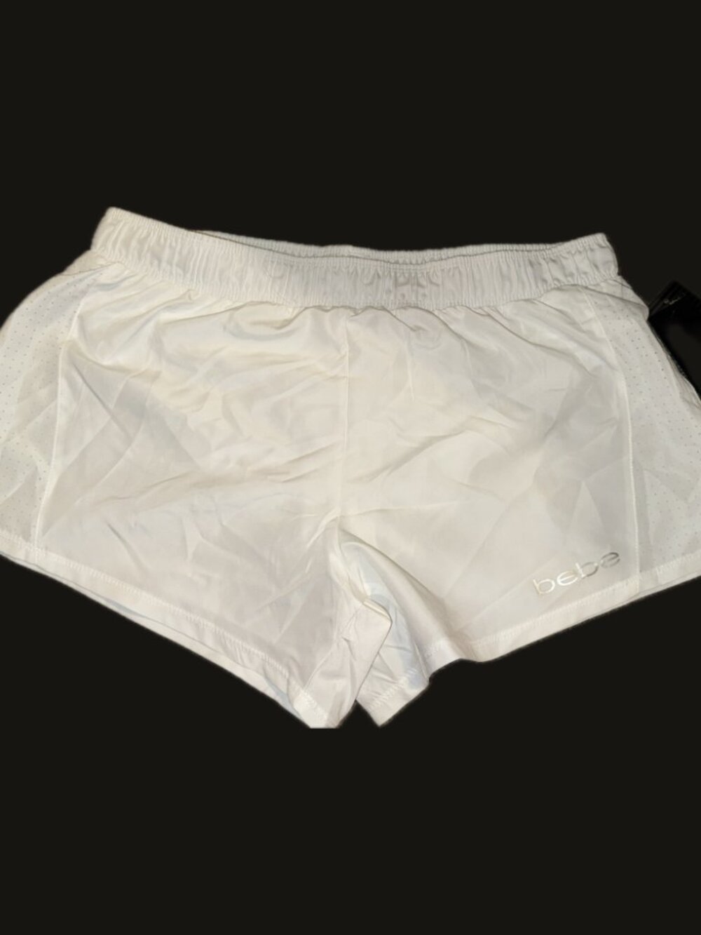 Bebe white women's perforated shorts